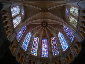 Cathedral ceiling with colorful stained glass windows.