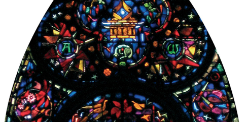 Stained glass window with colorful geometric patterns.