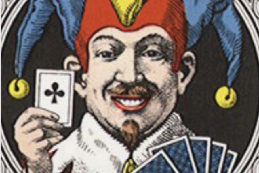 A man in a jester hat holding cards.