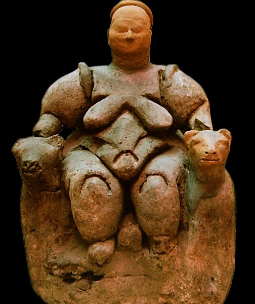 A statue of a woman sitting on top of a cat.