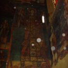 A painting of jesus is hanging on the wall.