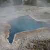 A blue pool in the middle of an area.