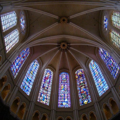 A cathedral with stained glass windows and a vaulted ceiling.
