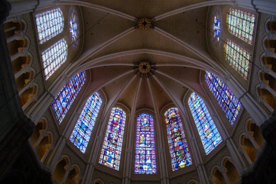 A cathedral with stained glass windows and a vaulted ceiling.