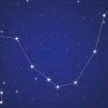 A blue background with stars and constellations.