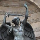 A statue of an angel holding a sword.