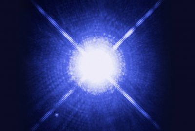 A blue light is shining on the ground.