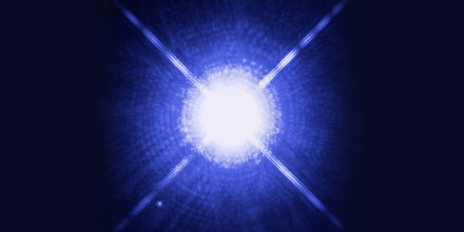 A blue light is shining on the ground.