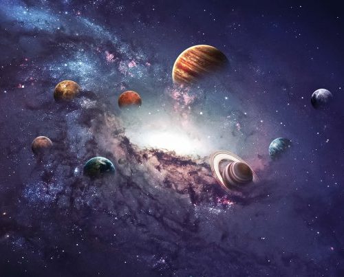 A group of planets in the sky with purple clouds.