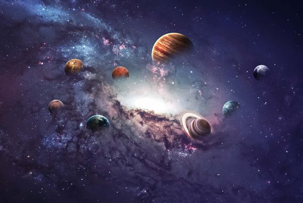 A group of planets in the sky with purple clouds.