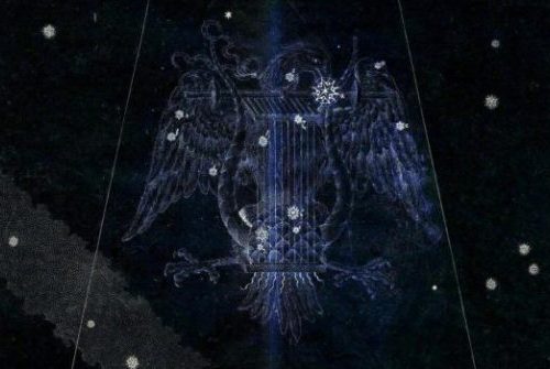A picture of the eagle with wings spread.