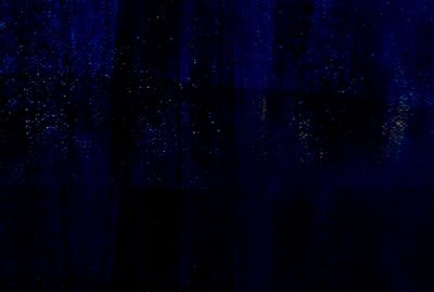 A dark blue background with some white dots