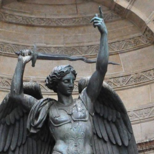 A statue of an angel holding a sword.