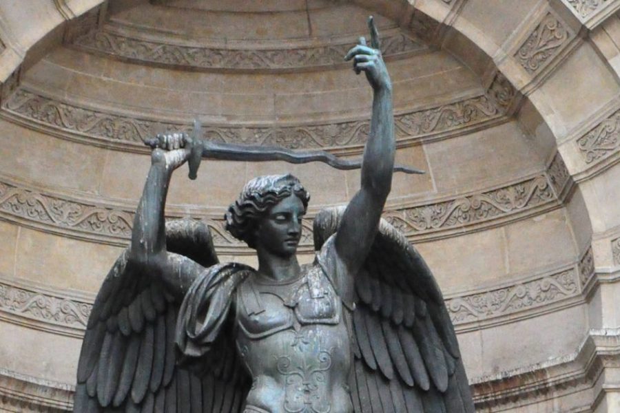 A statue of an angel holding a sword.