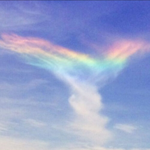 A rainbow in the shape of an x.