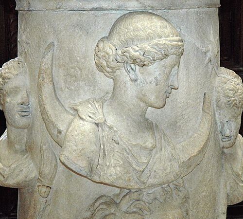 A close up of the face on a statue