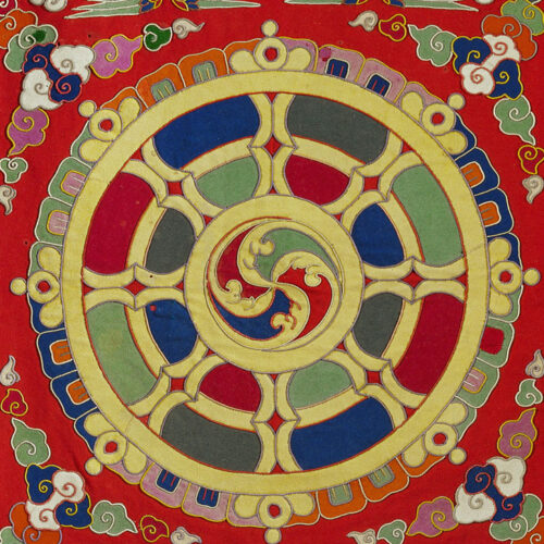 A colorful painting of a circular design on the wall.