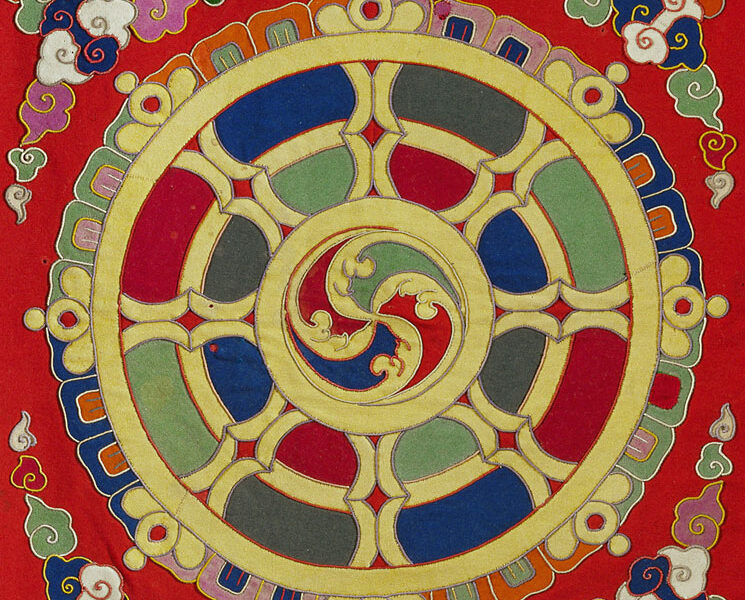 A colorful painting of a circular design on the wall.