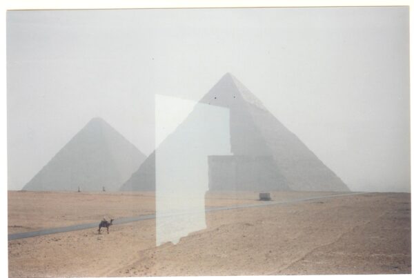 A picture of the pyramids in egypt with a glass window.