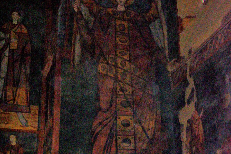 A painting of an angel in the middle of a church.