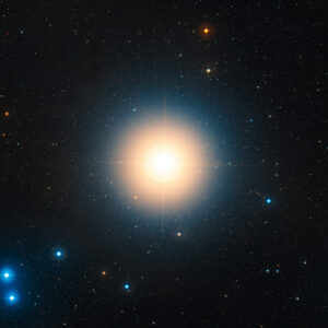 Bright star surrounded by smaller distant stars.